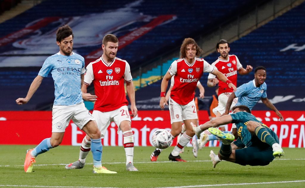 Arsenal decide to sell Emi Martinez to Aston Villa 2 Arsenal's Argentinian goalkeeper Emiliano Martinez (R) saves from Manchester City's Spanish midfielder David Silva (L) during the English FA Cup semi-final football match between Arsenal and Manchester City at Wembley Stadium in London, on July 18, 2020. (Photo by MATTHEW CHILDS / POOL / AFP)
