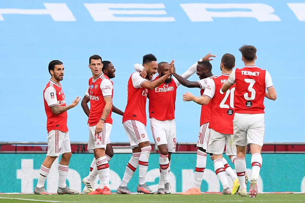 Arsenal's Gabonese striker Pierre-Emerick Aubameyang (CL) celebrates scoring the opening goal during the English FA Cup semi-final football match b...
