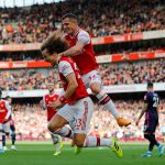 Asenal's Brazilian defender David Luiz (L) celebrates with Arsenal's Swiss midfielder Granit Xhaka after scoring the opening goal of the English Premier League football match between Arsenal and Bournemouth at the Emirates Stadium in London on October 6, 2019. (Photo by Tolga AKMEN / AFP)