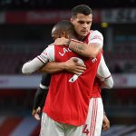 Arsenal's French striker Alexandre Lacazette (L) celebrates with Arsenal's Swiss midfielder Granit Xhaka (R) after scoring their first goal during the English Premier League football match between Arsenal and Liverpool at the Emirates Stadium in London on July 15, 2020. (Photo by Shaun Botterill / POOL / AFP)