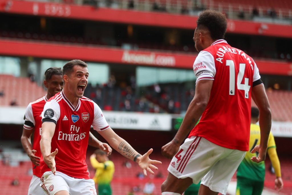 Arteta explains how Xhaka turned things around at Arsenal 2 Arsenal's Swiss midfielder Granit Xhaka celebrates with Arsenal's Gabonese striker Pierre-Emerick Aubameyang (R) after scoring a goal during the English Premier League football match between Arsenal and Norwich City at the Emirates Stadium in London on July 1, 2020. (Photo by MIKE EGERTON / POOL / AFP) / RESTRICTED TO EDITORIAL USE. No use with unauthorized audio, video, data, fixture lists, club/league logos or 'live' services. Online in-match use limited to 120 images. An additional 40 images may be used in extra time. No video emulation. Social media in-match use limited to 120 images. An additional 40 images may be used in extra time. No use in betting publications, games or single club/league/player publications. / (Photo by MIKE EGERTON/POOL/AFP via Getty Images)