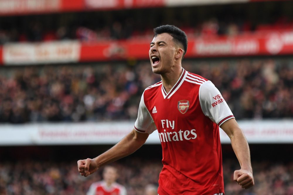 Arsenal's Brazilian striker Gabriel Martinelli (C) celebrates scoring the opening goal during the English Premier League football match between Ars...