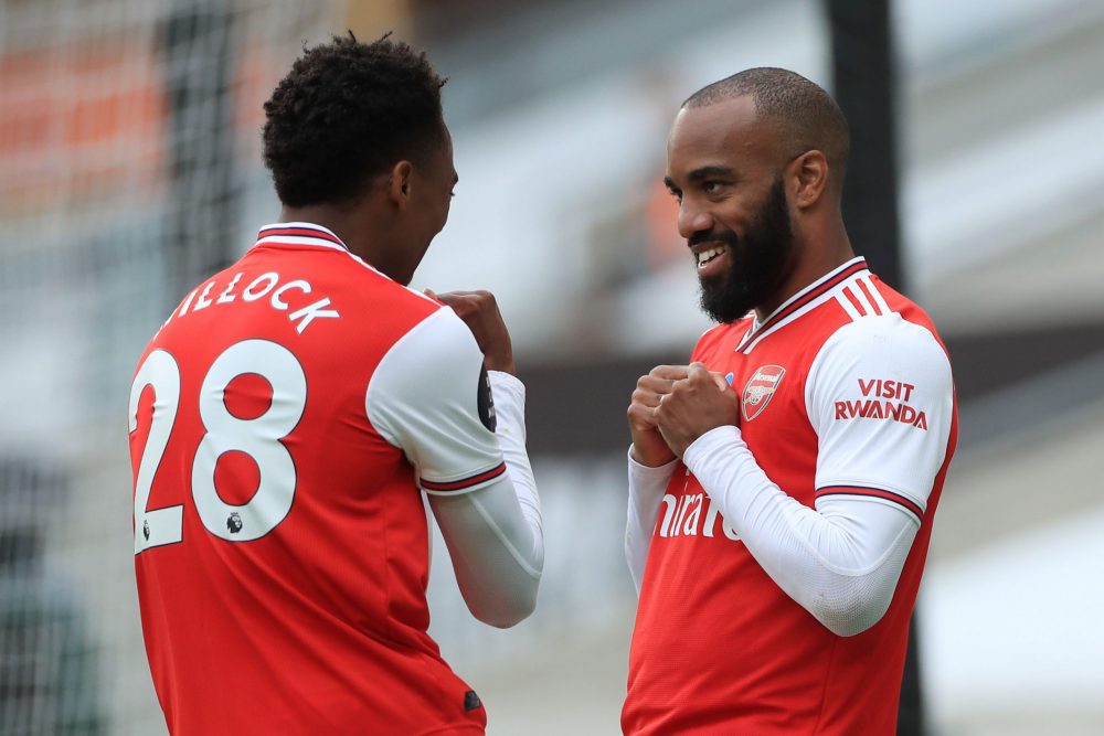 Arsenal's French striker Alexandre Lacazette (R) celebrates scoring their second goal with Arsenal's English midfielder Joe Willock (L) during the ...