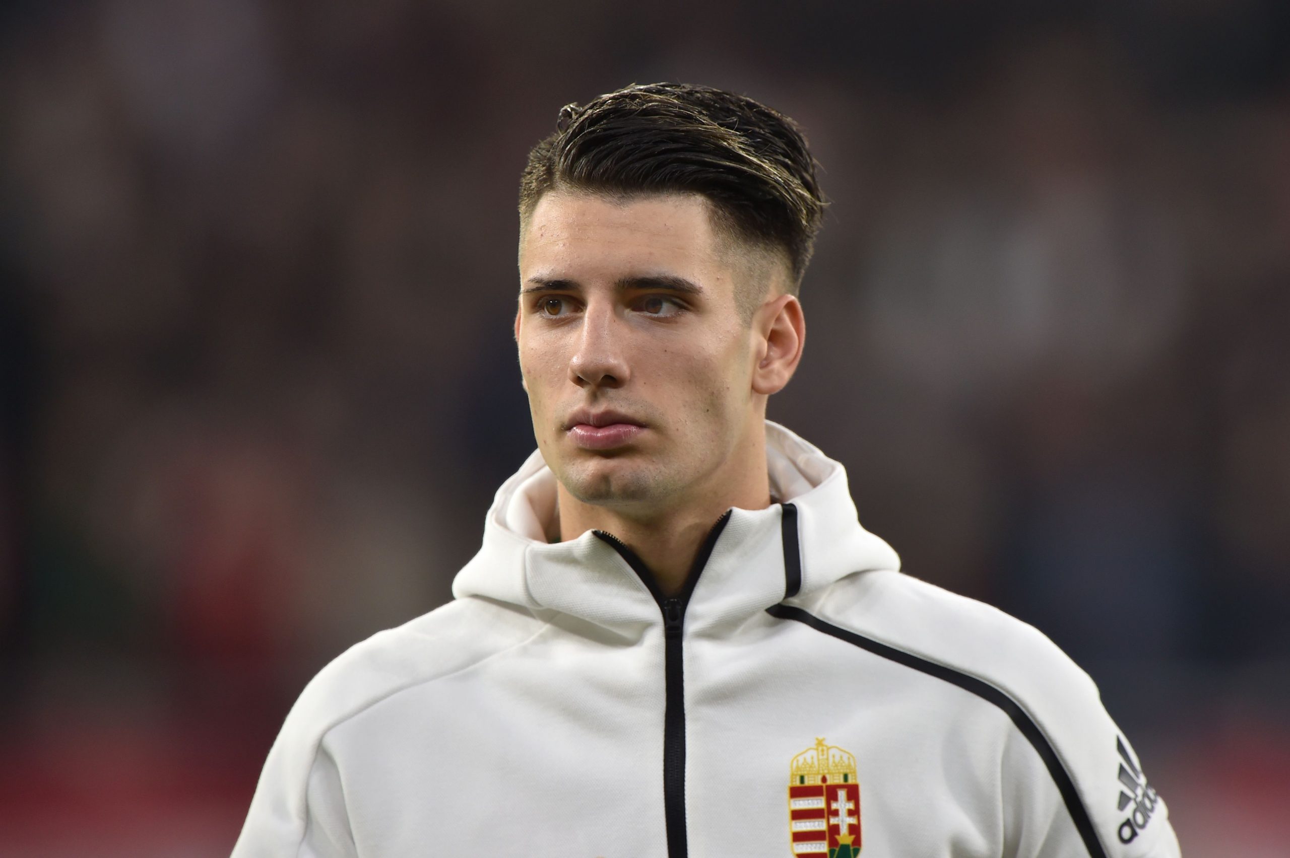 Hungary's midfielder Dominik Szoboszlai listens to the national anthems prior to the stadium inauguration friendly match between Hungary and Urugua...