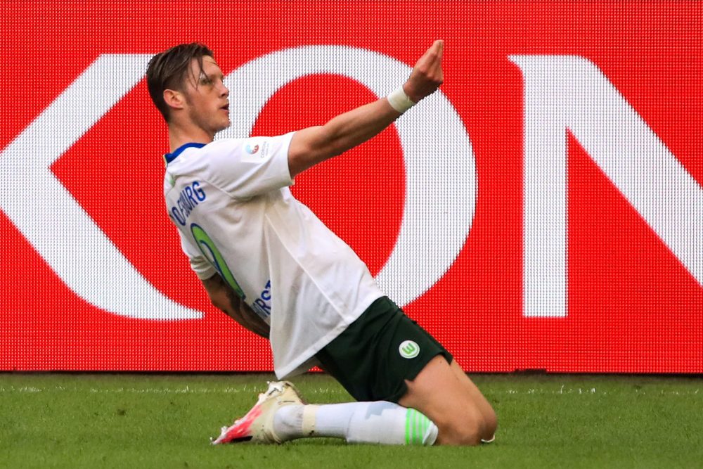 Wolfsburg's Dutch forward Wout Weghorst celebrates after scoring a goal during the German first division Bundesliga football match Schalke 04 v VfL...