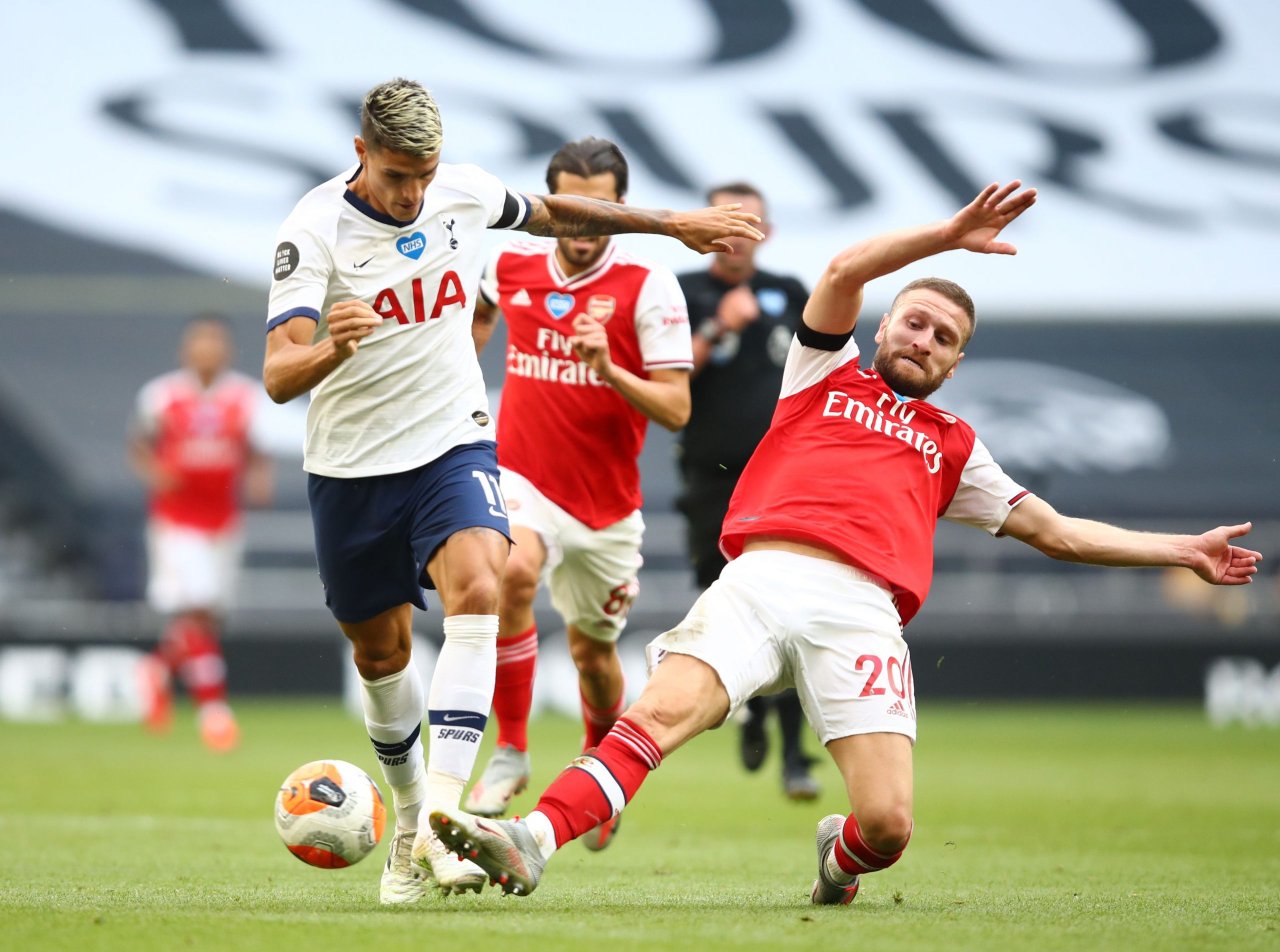Mikel Arteta pushing for new Shkodran Mustafi deal 2 LONDON, ENGLAND - JULY 12: Erik Lamela of Tottenham Hotspur battles for possession with Shkodran Mustafi of Arsenal during the Premier League match between Tottenham Hotspur and Arsenal FC at Tottenham Hotspur Stadium on July 12, 2020 in London, England. Football Stadiums around Europe remain empty due to the Coronavirus Pandemic as Government social distancing laws prohibit fans inside venues resulting in all fixtures being played behind closed doors. (Photo by Julian Finney/Getty Images)