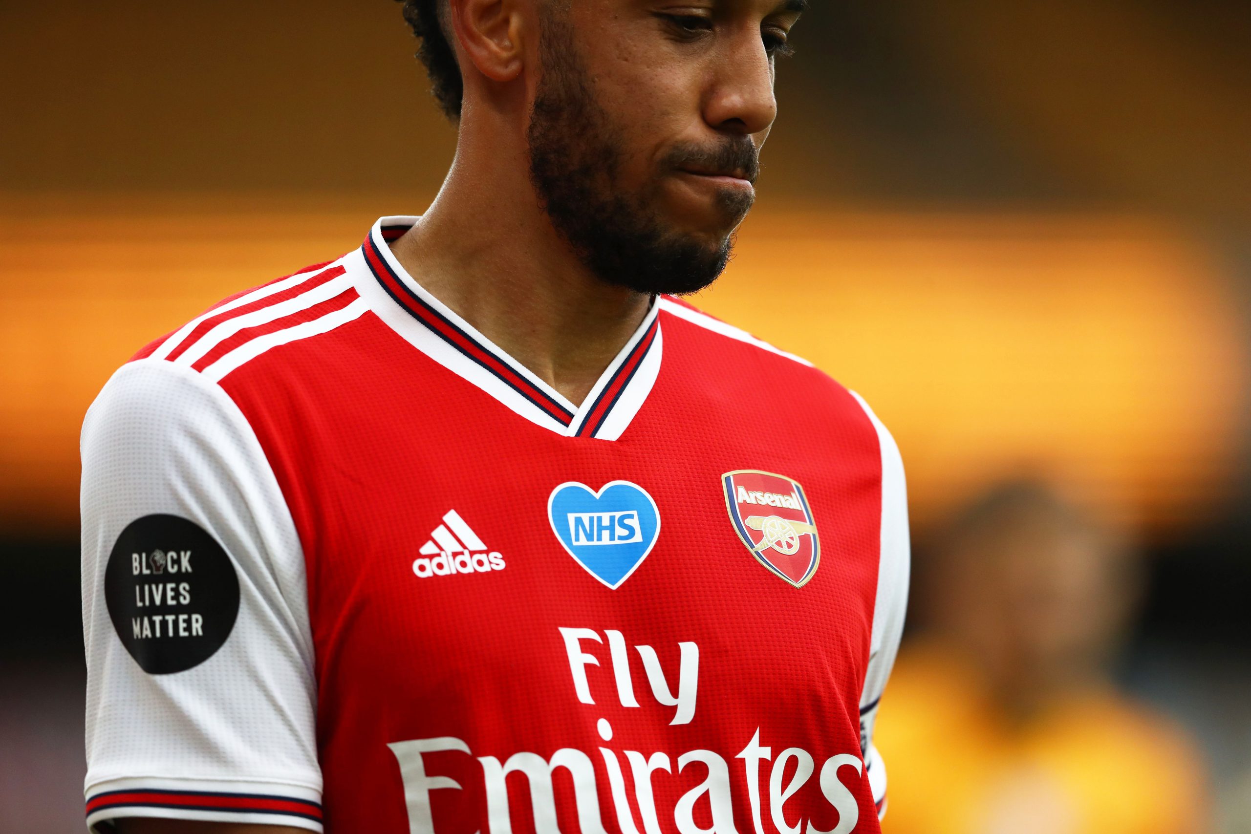 WOLVERHAMPTON, ENGLAND - JULY 04: A detail view of Pierre-Emerick Aubameyang of Arsenal's shirt displaying an NHS logo during the Premier League ma...