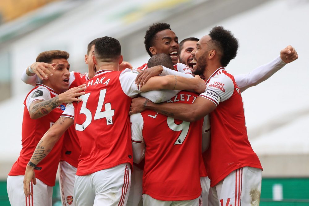 WOLVERHAMPTON, ENGLAND - JULY 04: Alexandre Lacazette of Arsenal (obscured) celebrates with teammates after scoring his team's second goal during t...