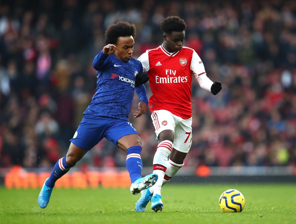 Mikel Arteta specifically requested Arsenal sign Willian despite concerns 2 LONDON, ENGLAND - DECEMBER 29: Willian of Chelsea and Bukayo Saka of Arsenal battle for possession during the Premier League match between Arsenal FC and Chelsea FC at Emirates Stadium on December 29, 2019 in London, United Kingdom. (Photo by Julian Finney/Getty Images)