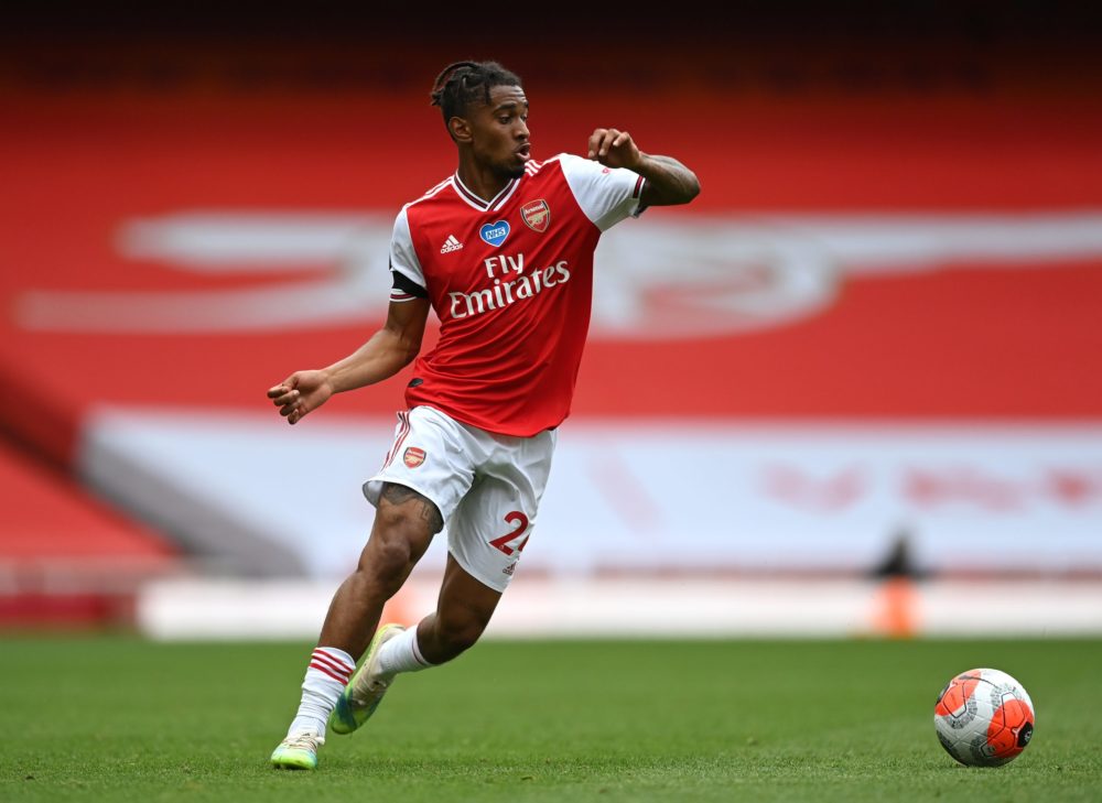 LONDON, ENGLAND - JULY 01: Reiss Nelson of Arsenal runs with the ball during the Premier League match between Arsenal FC and Norwich City at Emirat...