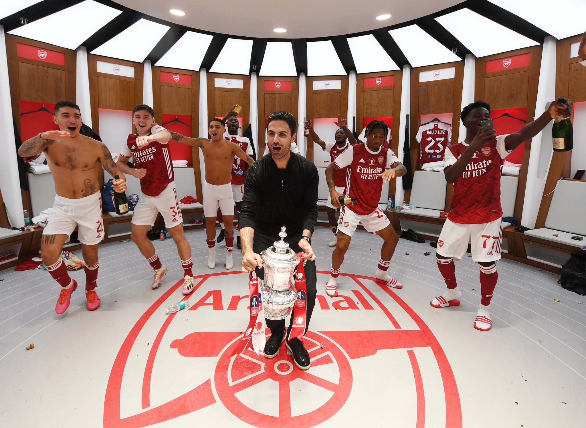 Superb dressing room shot as Mikel Arteta and players celebrate FA Cup win 3 Mikel Arteta and Arsenal players celebrate in Wembley dressing room(via Arsenal.com)