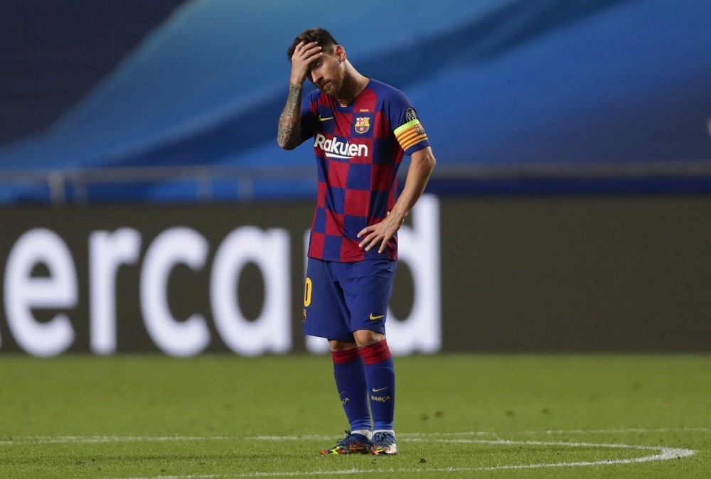 LISBON, PORTUGAL - AUGUST 14: Lionel Messi of FC Barcelona looks dejected during the UEFA Champions League Quarter Final match between Barcelona an...