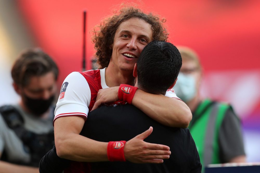 Arsenal's Spanish head coach Mikel Arteta (R) celebrates with Arsenal's Brazilian defender David Luiz during the English FA Cup final football matc...