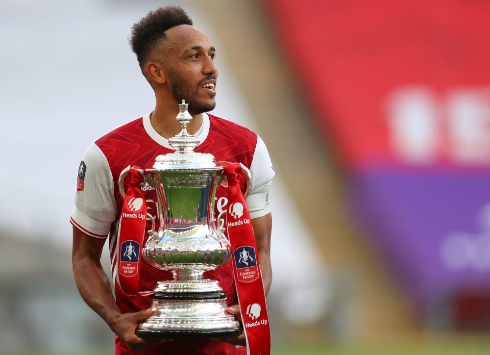 Pierre-Emerick Aubameyang wants minimum £70kpw wage increase from Arsenal 2 Arsenal's Gabonese striker Pierre-Emerick Aubameyang holds the winner's trophy as the team celebrates victory after the English FA Cup final football match between Arsenal and Chelsea at Wembley Stadium in London, on August 1, 2020. - Arsenal won the match 2-1. (Photo by Catherine Ivill / POOL / AFP)
