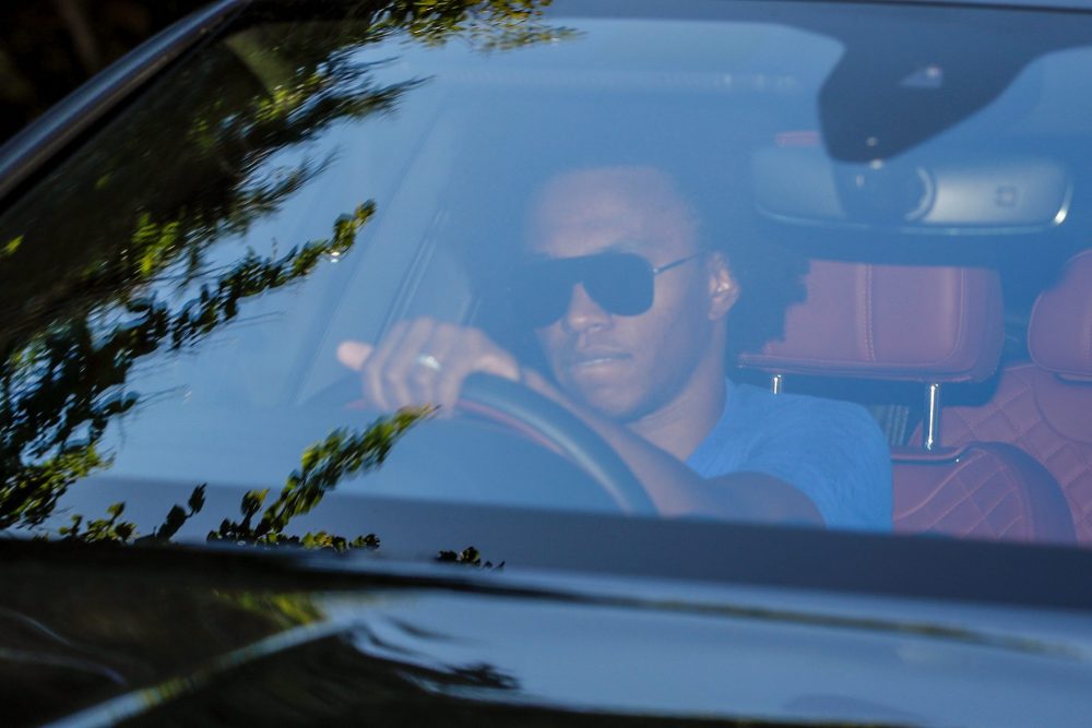 Chelsea's Brazilian midfielder Willian arrives at Chelsea's Cobham training facility in Stoke D'Abernon, southwest of London on May 19, 2020 as tra...