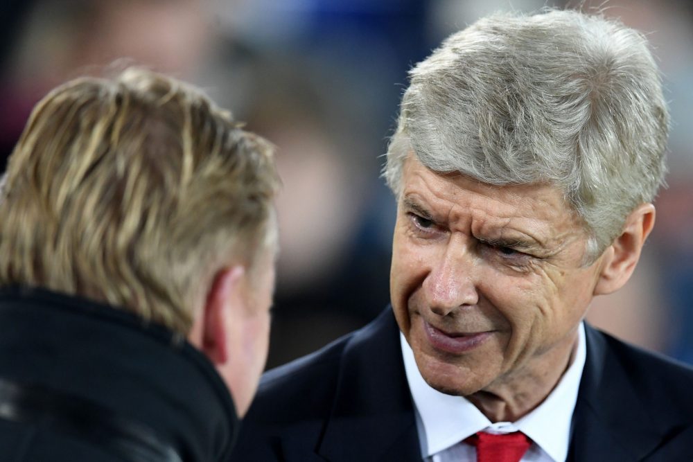 Everton's Dutch manager Ronald Koeman (L) greets Arsenal's French manager Arsene Wenger ahead of the English Premier League football match between ...