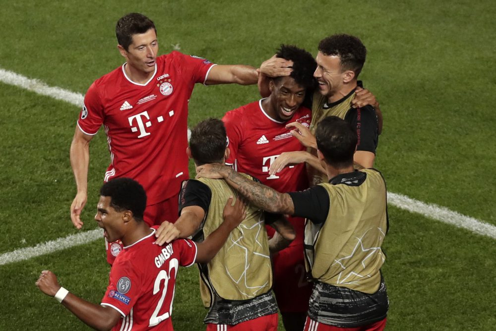 Bayern Munich's French forward Kingsley Coman (C) celebrates with Bayern Munich's Polish forward Robert Lewandowski (Top L) and Bayern Munich's Croatian midfielder Ivan Perisic (Top R) after opening the scoring during the UEFA Champions League final football match between Paris Saint-Germain and Bayern Munich at the Luz stadium in Lisbon on August 23, 2020. (Photo by Manu Fernandez / POOL / AFP) (Photo by MANU FERNANDEZ/POOL/AFP via Getty Images)