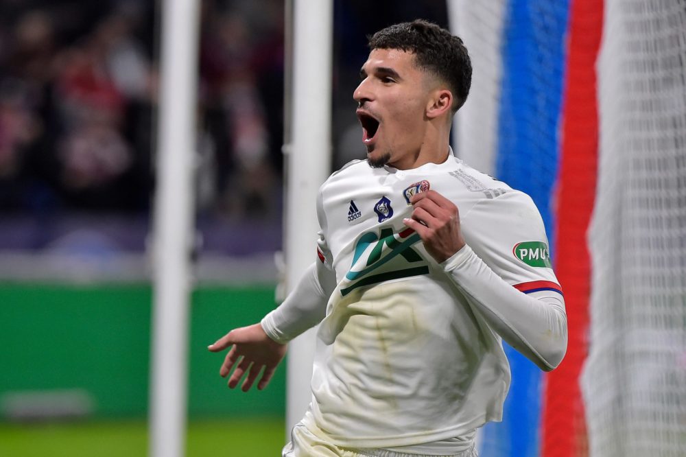 Lyon's French midfielder Houssem Aouar celebrates after scoring the opener during the French Cup quarter-final football match between Olympique Lyo...
