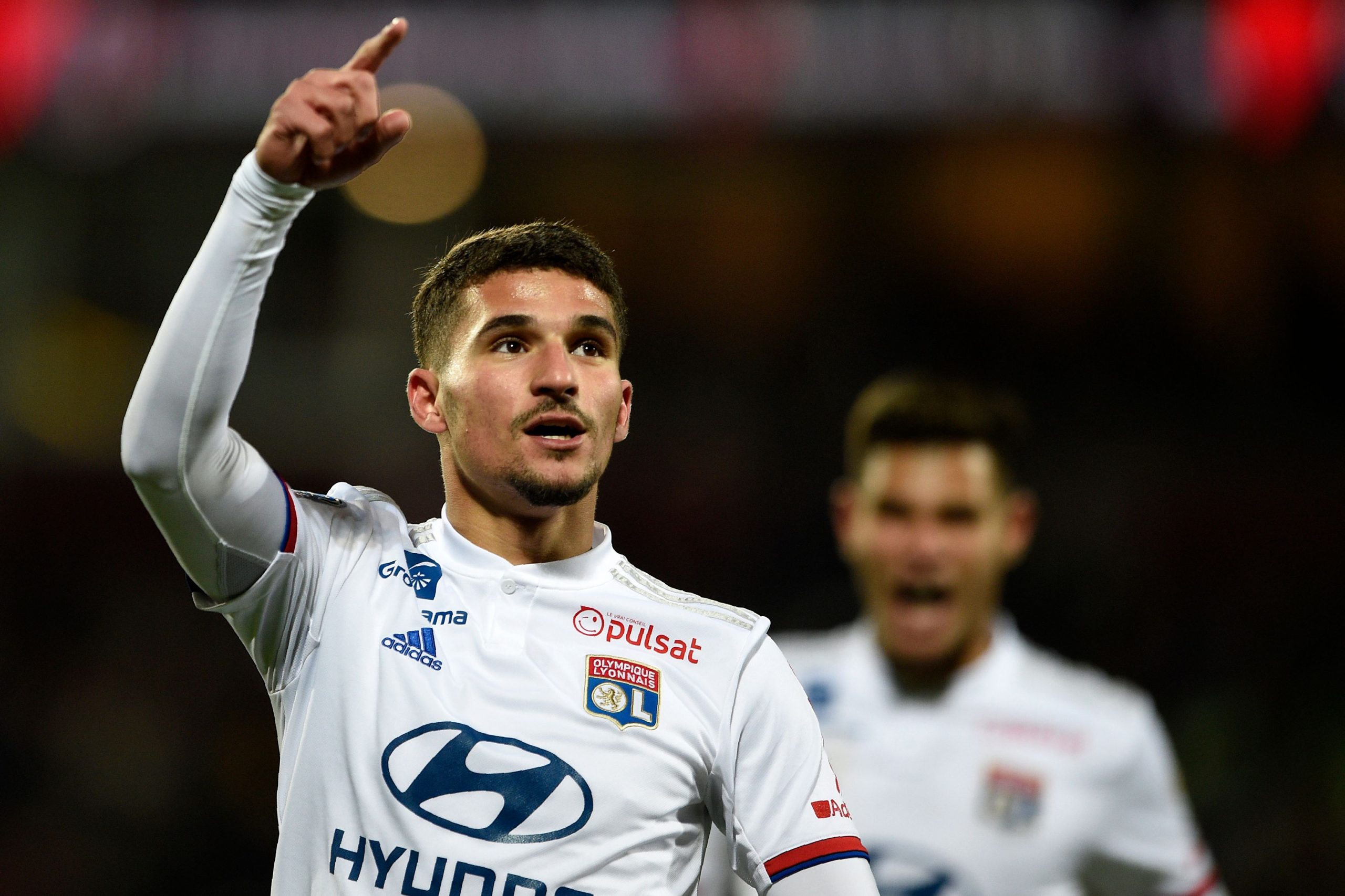 Lyon's French midfielder Houssem Aouar celebrates after scoring a goal during the French L1 football match between FC Metz and Olympique Lyonnais a...