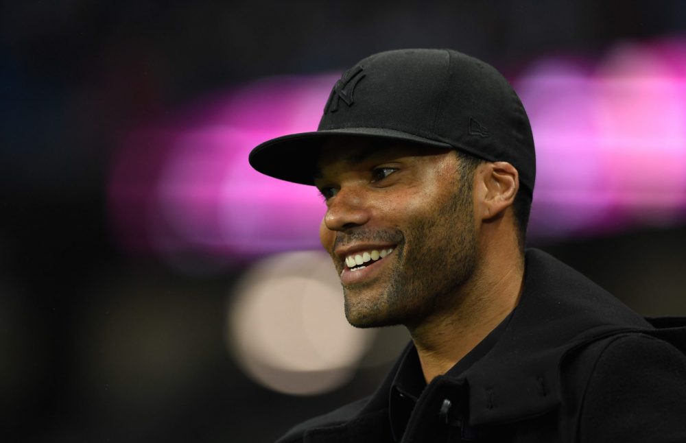 MANCHESTER, ENGLAND - AUGUST 21: Former Manchester City player Joleon Lescott looks on during the Premier League match between Manchester City and ...