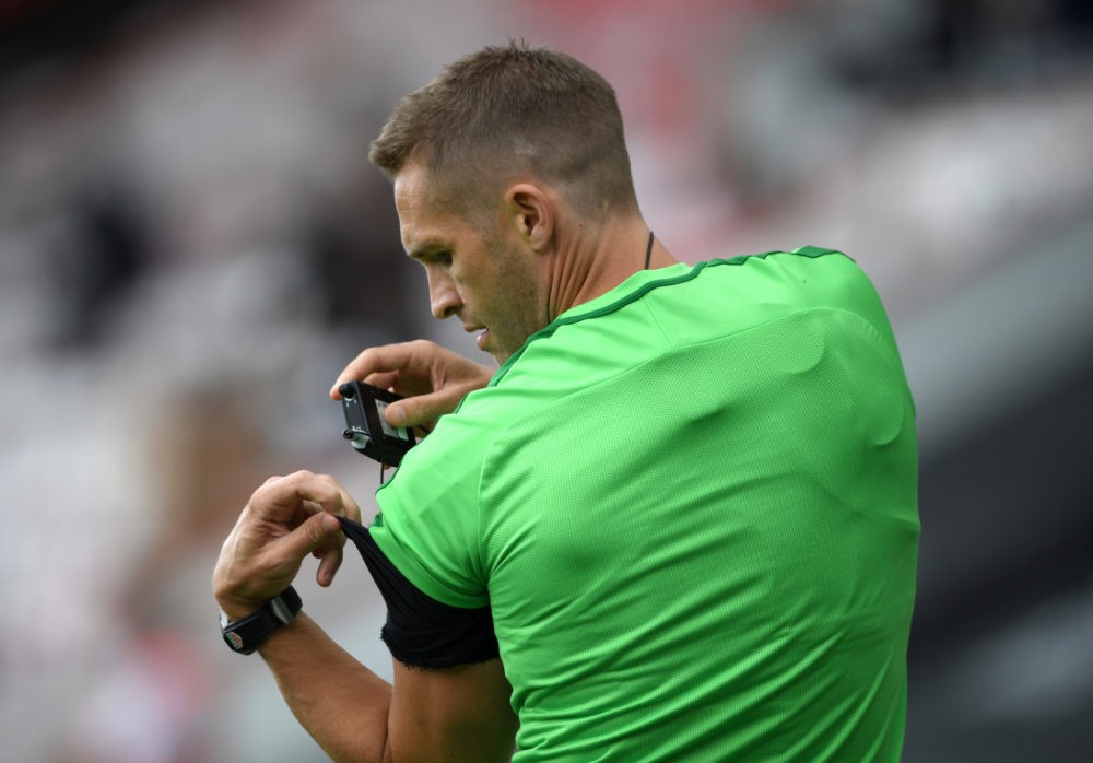 Arsenal BOURNEMOUTH, ENGLAND - JULY 19: Match Referee Craig Pawson is seen adjusting his hearing device ahead of the Premier League match between A...