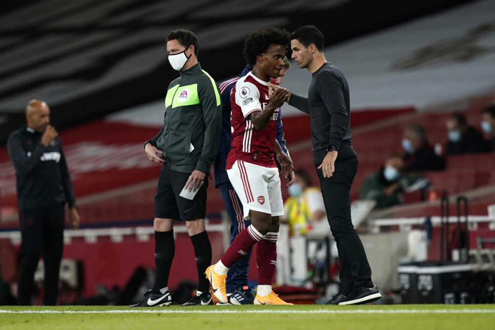 LONDON, ENGLAND - SEPTEMBER 19: Mikel Arteta, Manager of Arsenal greets Willian of Arsenal as he is substituted off during the Premier League match...