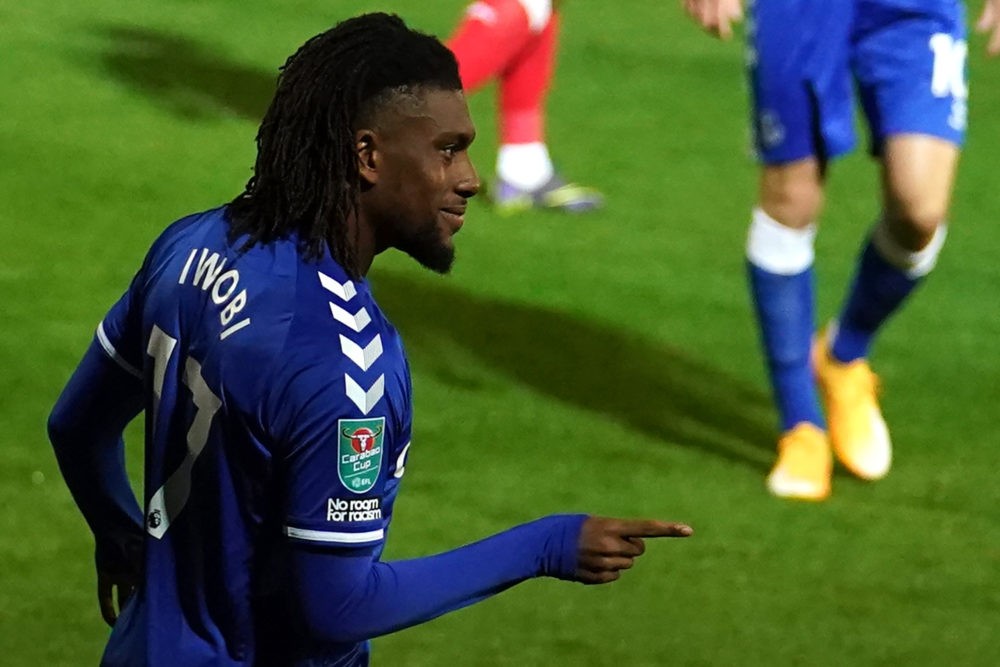 Everton's Nigerian midfielder Alex Iwobi celebrates after he scores his team's third goal during the English League Cup third round football match ...