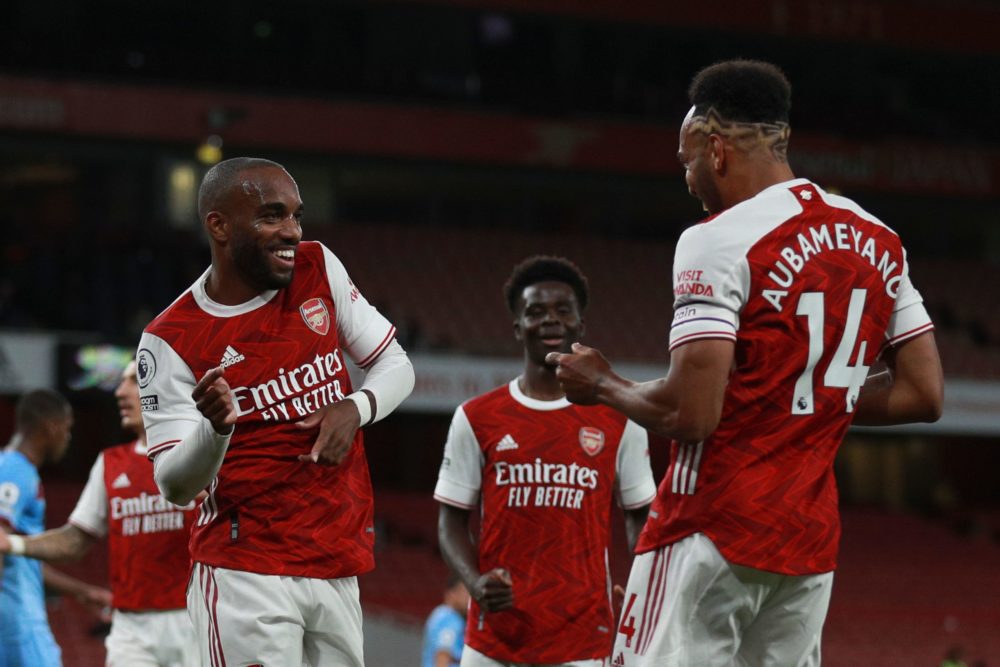 Arsenal's French striker Alexandre Lacazette (L) celebrates scoring the opening goal with Arsenal's Gabonese striker Pierre-Emerick Aubameyang who ...