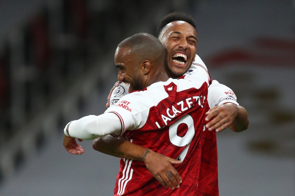 Arsenal's French striker Alexandre Lacazette (L) celebrates scoring the opening goal with Arsenal's Gabonese striker Pierre-Emerick Aubameyang (R) ...