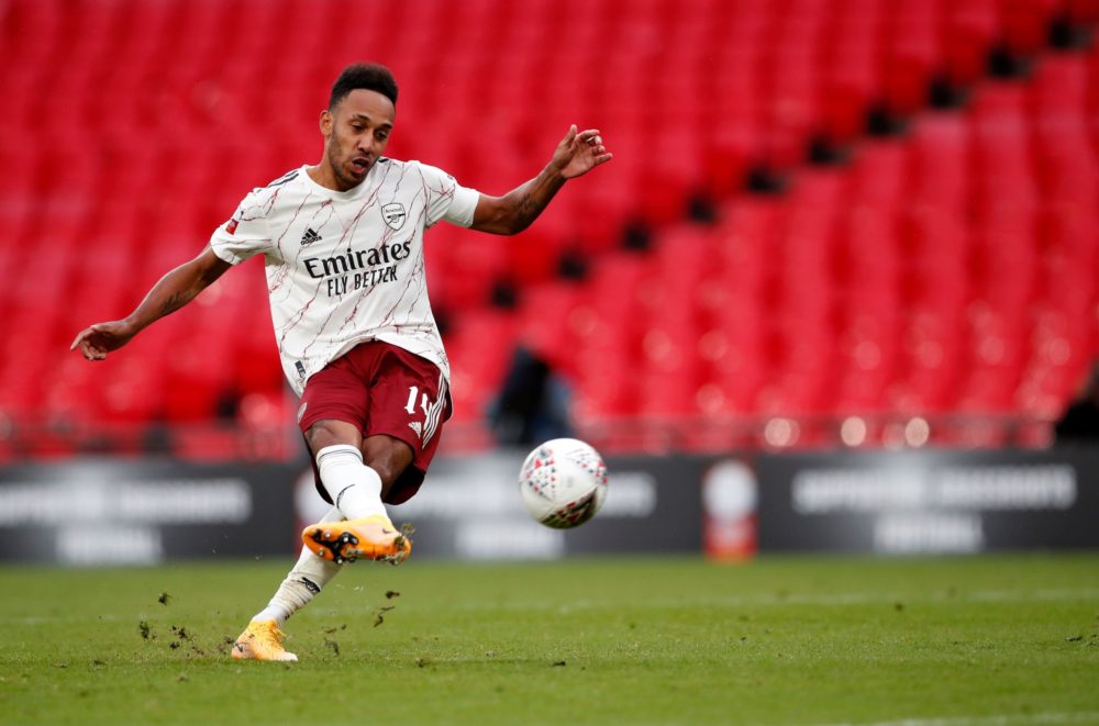 Arsenal's Gabonese striker Pierre-Emerick Aubameyang scores the winning penalty in the shoot-out to win the English FA Community Shield football ma...