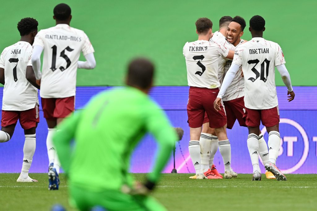 Arsenal players run to celebrate after Pierre-Emerick Aubameyang (2nd R) scored his team's first goal during the English FA Community Shield football match between Arsenal and Liverpool at Wembley Stadium in north London on August 29, 2020. (Photo by JUSTIN TALLIS / POOL / AFP) / NOT FOR MARKETING OR ADVERTISING USE / RESTRICTED TO EDITORIAL USE (Photo by JUSTIN TALLIS/POOL/AFP via Getty Images)