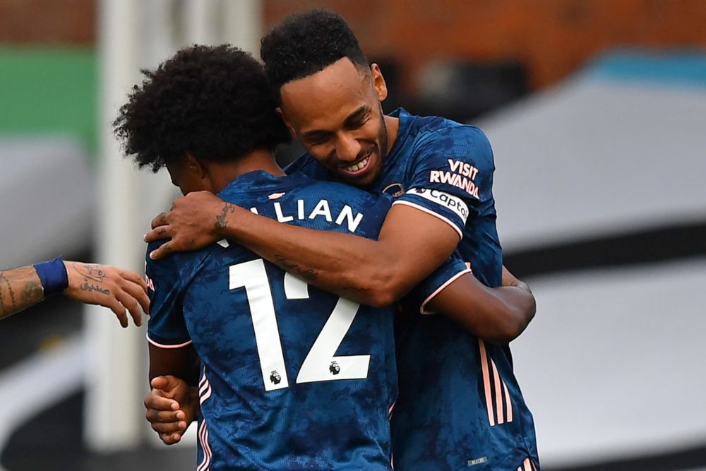 Arsenal's Gabonese striker Pierre-Emerick Aubameyang (R) celebrates scoring their third goal with Arsenal's Brazilian midfielder Willian (L) during the English Premier League football match between Fulham and Arsenal at Craven Cottage in London on September 12, 2020. (Photo by Ben STANSALL / POOL / AFP)