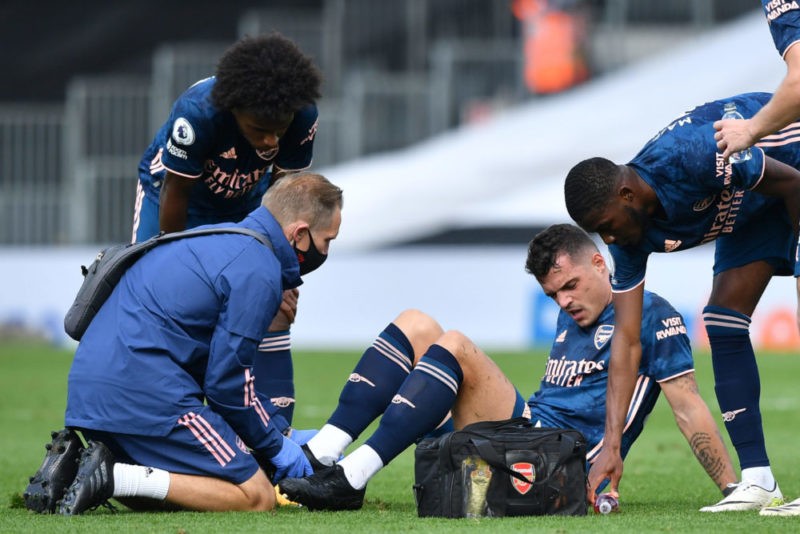 Who is fit to lineup for Arsenal vs West Ham? 2 Arsenal's Swiss midfielder Granit Xhaka (floor) gets attention after a knock during the English Premier League football match between Fulham and Arsenal at Craven Cottage in London on September 12, 2020. (Photo by Ben STANSALL / POOL / AFP)
