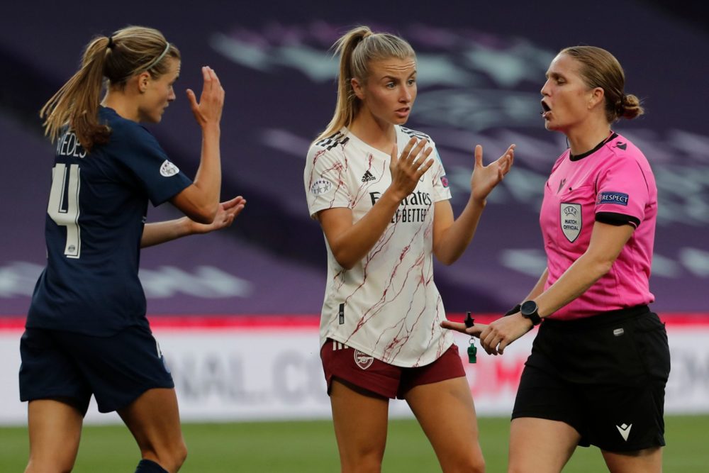 Paris Saint-Germain's Spanish defender Irene Paredes (L) and Arsenal's English defender Leah Williamson talk to Swiss referee Esther Staubli (R) du...