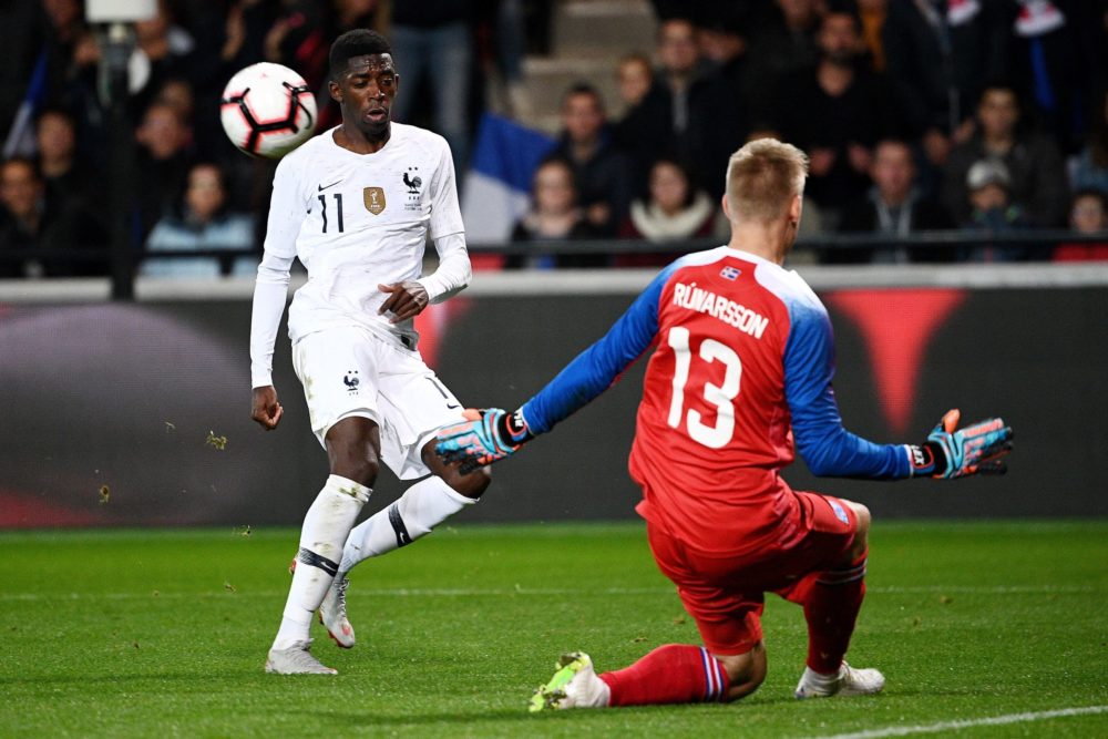 France's forward Ousmane Dembele (L) vies with Iceland's goalkeeper Runar Alex Runarsson during the friendly football match between France and Icel...