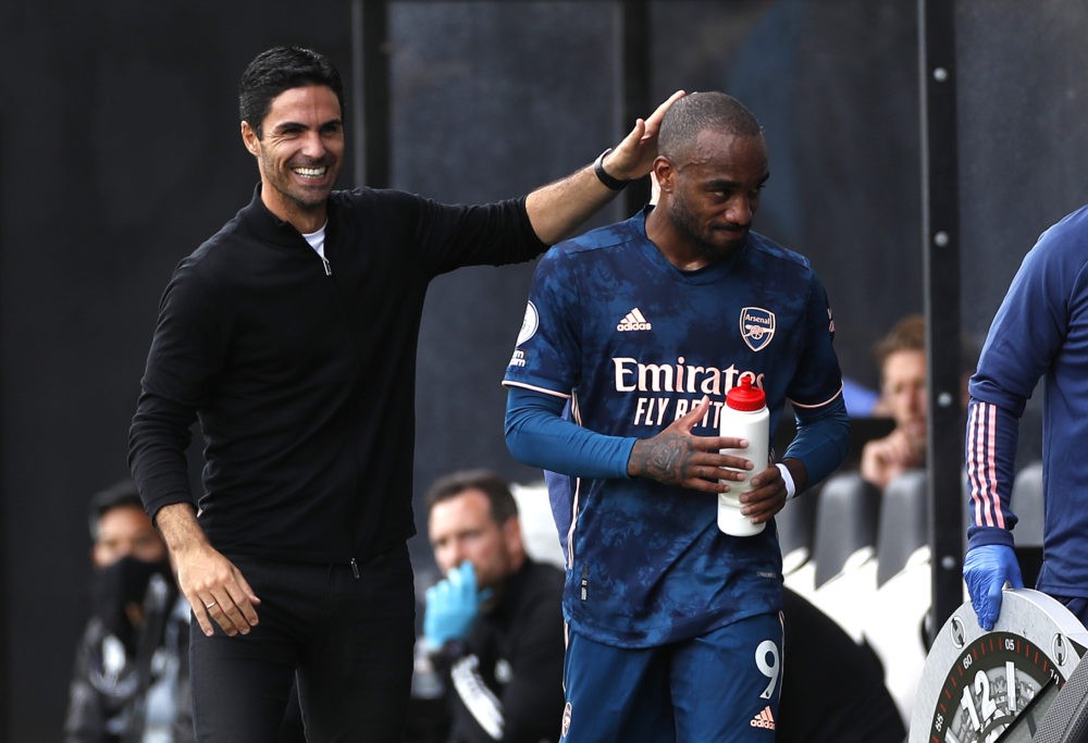 LONDON, ENGLAND - SEPTEMBER 12: Mikel Arteta, Manager of Arsenal interacts with Alexandre Lacazette of Arsenal after he is subbed during the Premie...