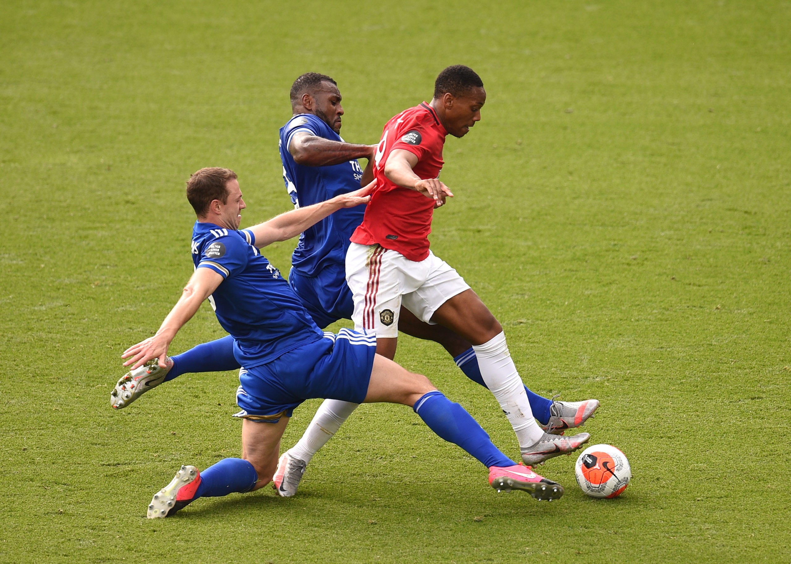 Tierney and Soares out: Arsenal team news update pre-Leicester 3 LEICESTER, ENGLAND - JULY 26: Anthony Martial of Manchester United is tackled by Wes Morgan and Jonny Evans both of Leicester City leading to a penalty during the Premier League match between Leicester City and Manchester United at The King Power Stadium on July 26, 2020 in Leicester, England.Football Stadiums around Europe remain empty due to the Coronavirus Pandemic as Government social distancing laws prohibit fans inside venues resulting in all fixtures being played behind closed doors. (Photo by Oli Scarff/Pool via Getty Images)