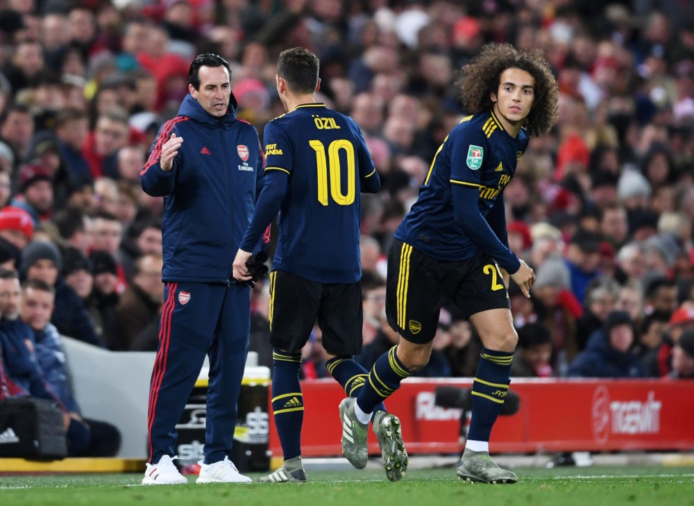 LIVERPOOL, ENGLAND - OCTOBER 30: Mesut Ozil of Arsenal shakes hands with Unai Emery, Manager of Arsenal as he is substituted for Matteo Guendouzi of Arsenal during the Carabao Cup Round of 16 match between Liverpool and Arsenal at Anfield on October 30, 2019 in Liverpool, England. (Photo by Laurence Griffiths/Getty Images)