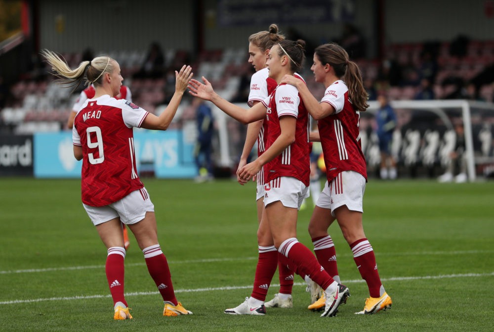 BOREHAMWOOD, ENGLAND - OCTOBER 18: Caitlin Foord of Arsenal celebrates with teammates after scoring her team's third goal during the Barclays FA Women's Super League match between Arsenal Women and Tottenham Hotspur Women at Meadow Park on October 18, 2020 in Borehamwood, England. Sporting stadiums around the UK remain under strict restrictions due to the Coronavirus Pandemic as Government social distancing laws prohibit fans inside venues resulting in games being played behind closed doors. (Photo by Catherine Ivill/Getty Images)