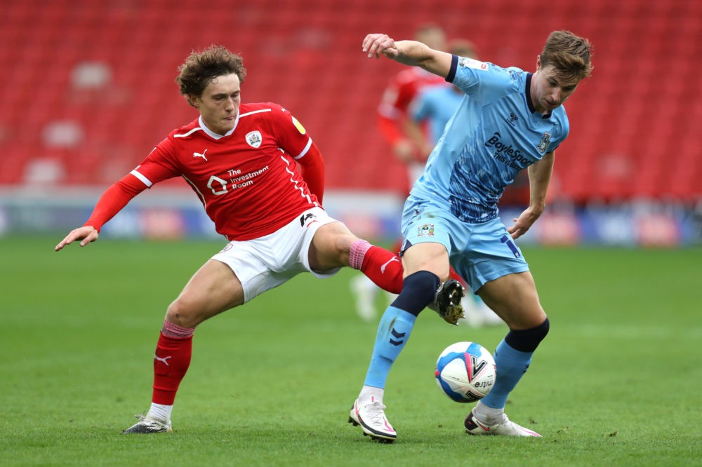 BARNSLEY, ENGLAND: Ben Sheaf of Coventry City battle for possession with Callum Styles of Barnsley during the Sky Bet Championship match between Ba...