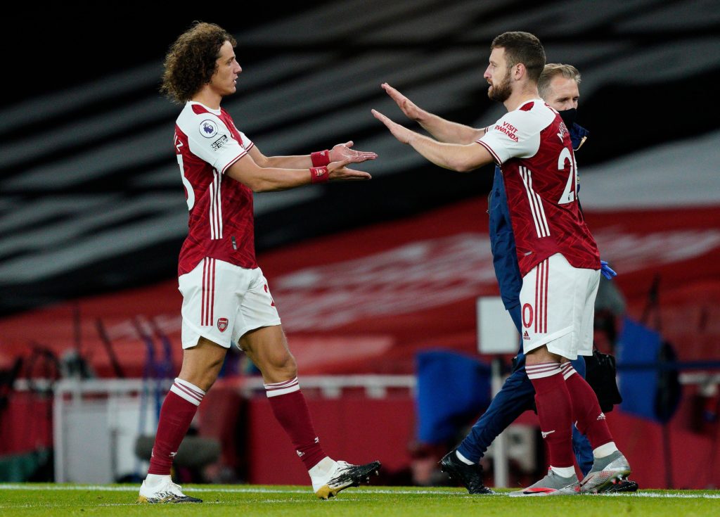 Arsenal's Brazilian defender David Luiz (L) leaves the pitch after being substituted off for Arsenal's German defender Shkodran Mustafi during the English Premier League football match between Arsenal and Leicester City at the Emirates Stadium in London on October 25, 2020. (Photo by WILL OLIVER/POOL/AFP via Getty Images)
