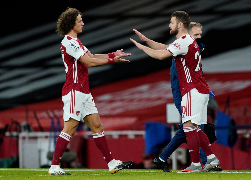 Arsenal's Brazilian defender David Luiz (L) leaves the pitch after being substituted off for Arsenal's German defender Shkodran Mustafi during the English Premier League football match between Arsenal and Leicester City at the Emirates Stadium in London on October 25, 2020. (Photo by WILL OLIVER/POOL/AFP via Getty Images)