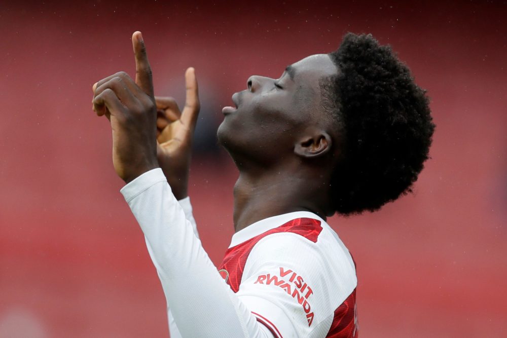 Arsenal's English striker Bukayo Saka celebrates scoring the opening goal during the English Premier League football match between Arsenal and Shef...