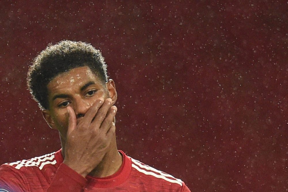 Manchester United's English striker Marcus Rashford (L) reacts during the English Premier League football match between Manchester United and Chels...