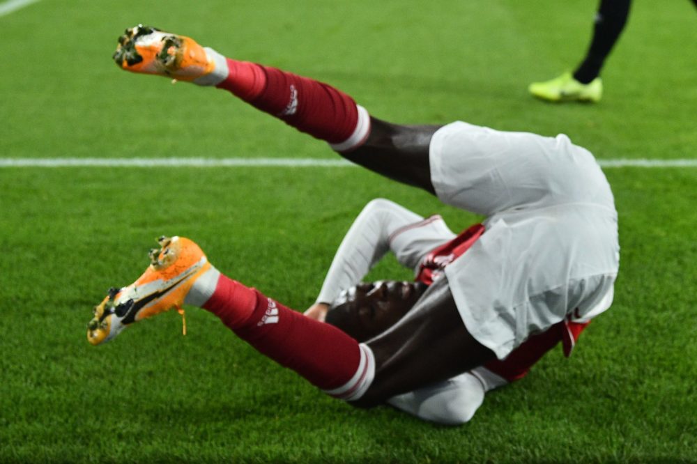 Arsenal's French-born Ivorian midfielder Nicolas Pepe takes a tumble during the UEFA Europa League 1st round day 2 Group B football match between A...