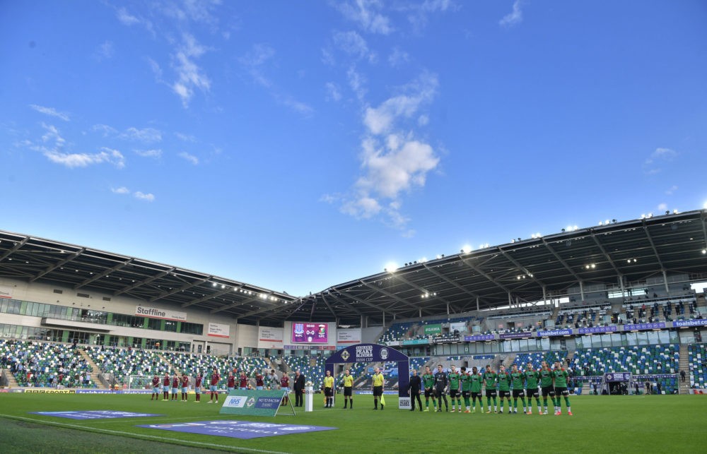 BELFAST, NORTHERN IRELAND: Ballymena United and Glentoran line up for the national anthem before the Irish Cup Final at Windsor Park on July 31, 20...