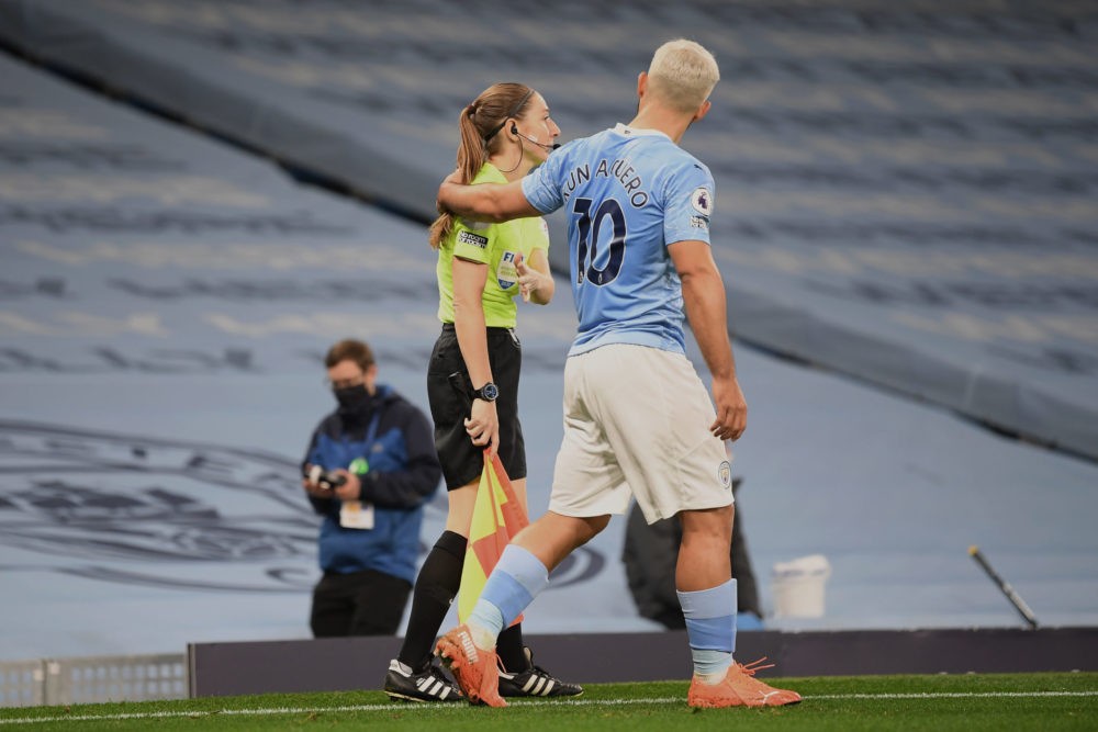 MANCHESTER, ENGLAND - OCTOBER 17: Assistant referee Sian Massey-Ellis and Sergio Aguero of Manchester City during the Premier League match between ...