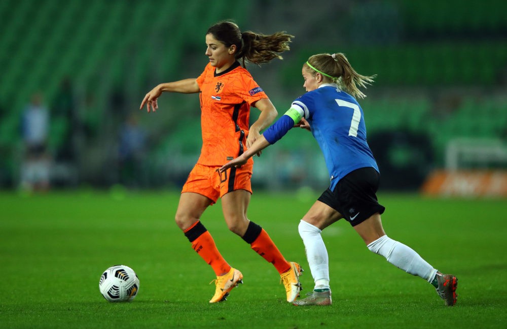 GRONINGEN, NETHERLANDS - OCTOBER 23:  Danielle van de Donk of Netherlands battles for possession with Katrin Loo of Estonia during the UEFA Women's EURO 2022 qualifier match between Netherlands Women's and Estonia Womens's at Hitachi Capital Mobility Stadion on October 23, 2020 in Groningen, Netherlands. (Photo by Dean Mouhtaropoulos/Getty Images)