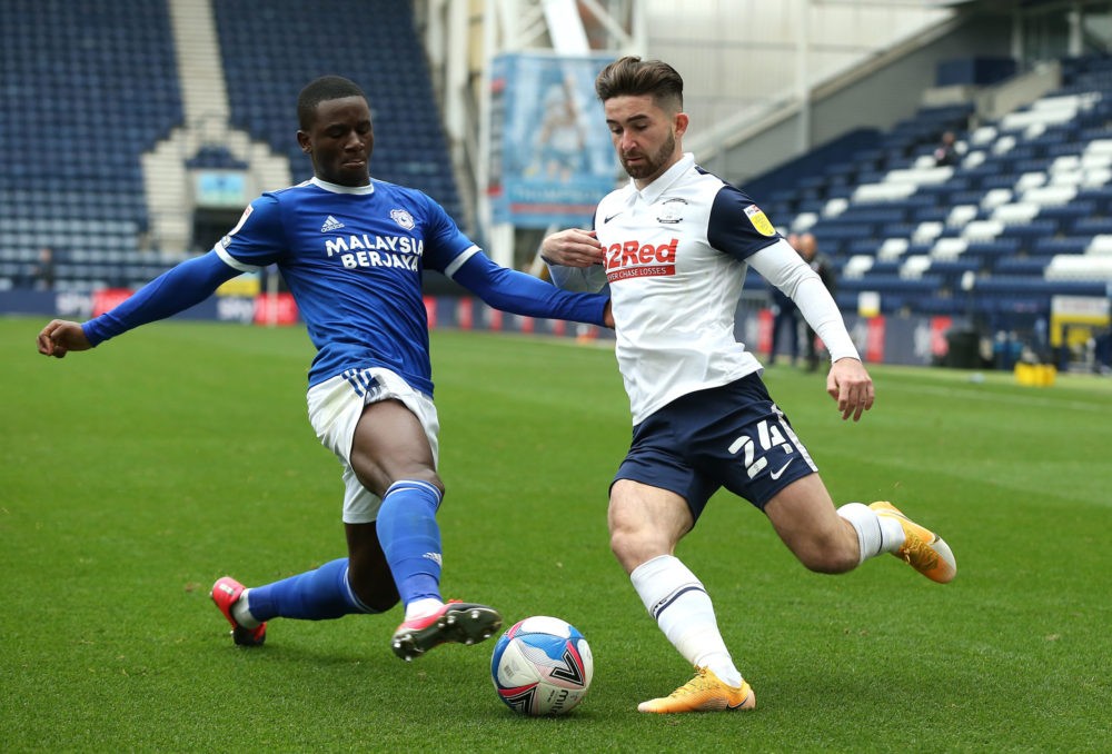 PRESTON, ENGLAND - OCTOBER 18: Jordi Osei-Tutu challenges Sean Maguire of Preston North End during the Sky Bet Championship match between Preston N...