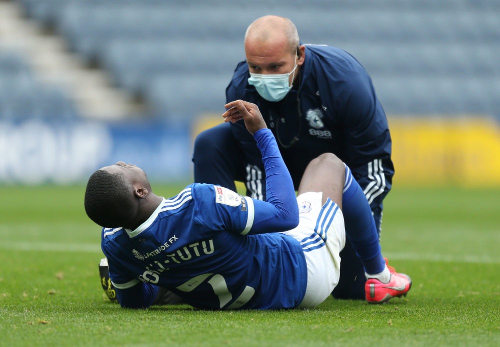 PRESTON, ENGLAND - OCTOBER 18: Jordi Osei-Tutu of Cardiff City receives medical treatment during the Sky Bet Championship match between Preston Nor...